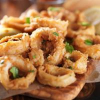 Calamari Fritti · Fried squid in a light butter with tomato sauce.
