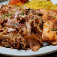 Chicken Shawarma Platter · Served with rice or French fries and grilled onions and tomatoes.