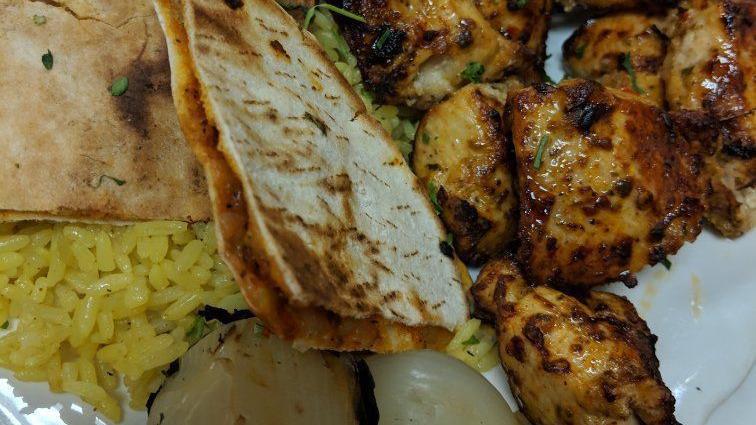 Half Grilled Chicken · chicken grilled in a natural charcoal grill. serve with rice or fries.