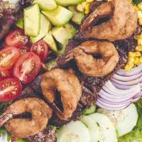 Ensalada Crispy Mar Y Tierra · Hand breaded shrimp and grilled juicy skirt steak with lettuce, cucumber, onions, corn bits,...