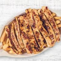 Kids Trocitos De Pollo Con Papitas Fritas · Grilled chicken with french fries.