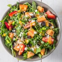 Papaya Dream Salad · Arugula, papaya, health grain mix, feta, dried cranberries, edamame, sunflower seeds, cilant...