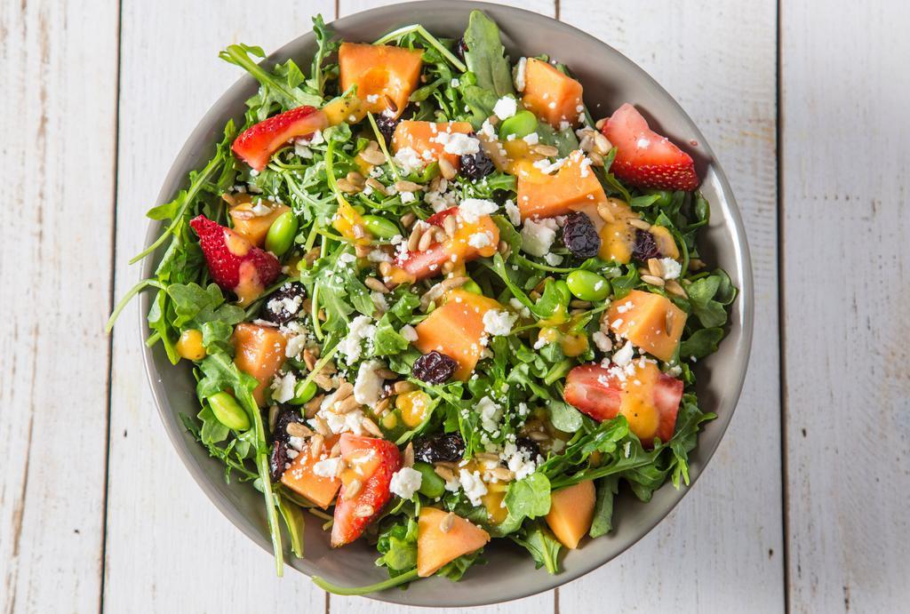 Papaya Dream Salad · Arugula, papaya, health grain mix, feta, dried cranberries, edamame, sunflower seeds, cilantro & mint, strawberries, papaya seed dressing