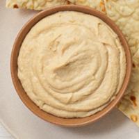 Hummus · Served with toasted pita bread, celery and carrot sticks.