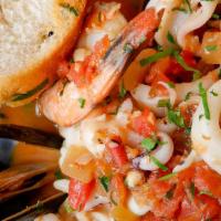 Seafood Risotto · Shrimp, calamari, mussels, homemade tomato sauce