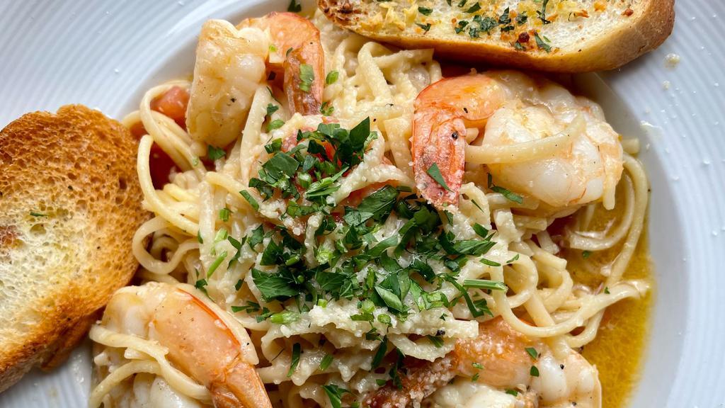 Shrimp Scampi · Succulent shrimp cooked in garlic butter sauce tossed with al dente linguini.
