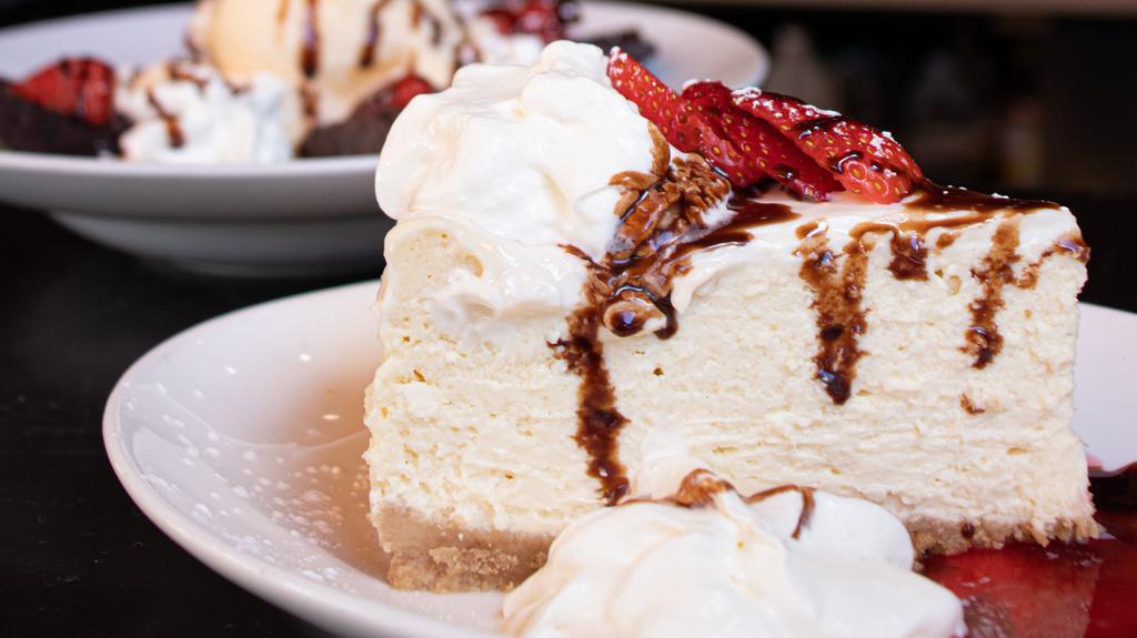 Cheesecake · Vanilla sour cream, strawberry sauce