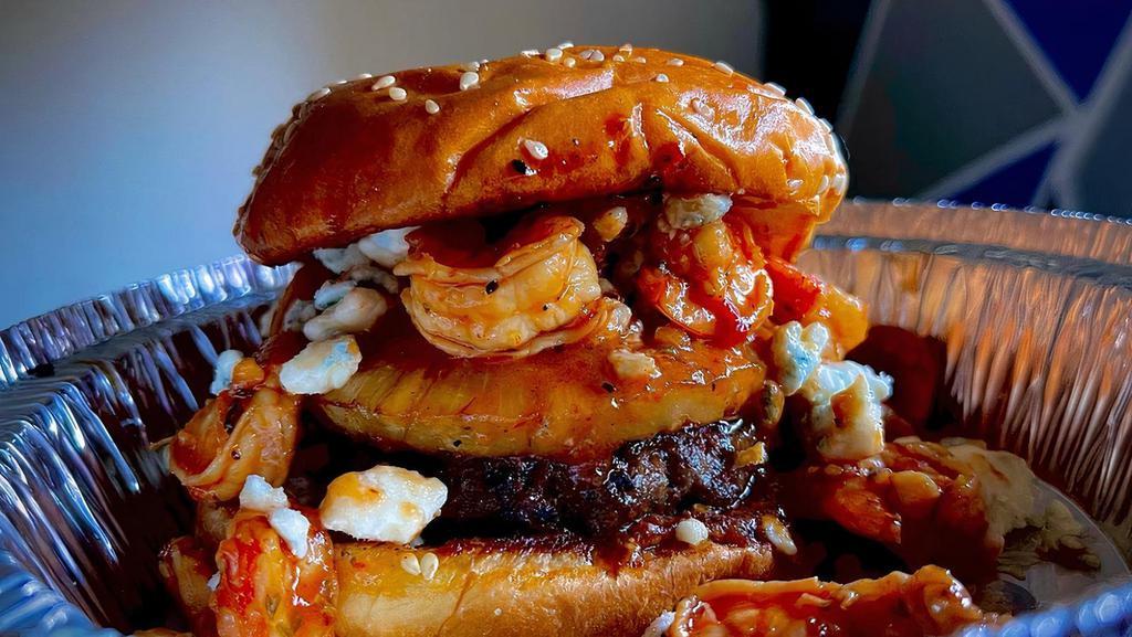 Island Fling  · Our burger topped with a grilled pineapple slice and sautéed shrimp in our secret sauce and blu cheese crumbles.