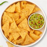 Guac Guac Away And Chips · A heaping scoop of fresh guacamole and warm tortilla chips