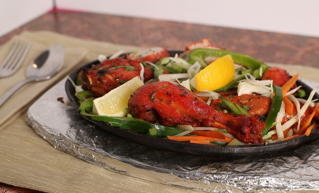 #51. Tandoori Assorted Appetizers (For Two) · Seekh kabob, shrimp tandoori and chicken tikka.