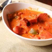 #115. Chicken Tikka Masala · Boneless pieces of chicken tikka cooked in a creamy butter sauce with fresh tomatoes and fra...