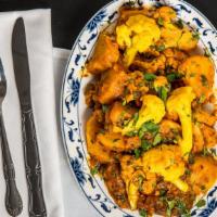 Aloo Gobhi · Potatoes cooked with cauliflower and Indian spices.