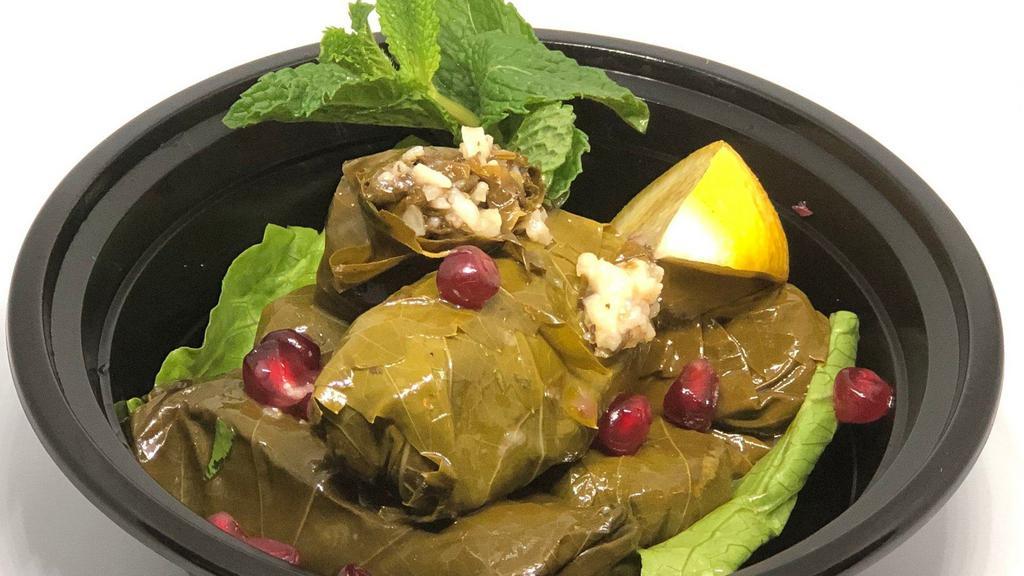  - Waraa Enab Bi Zeit · Hand rolled stuffed grape leaves with tangy tomato, parsley and rice stuffing