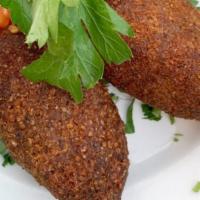  - Kibbeh Kras · Lebanon's national dish. A mixture of lean beef and bulgur wheat filled with a mixture of gr...