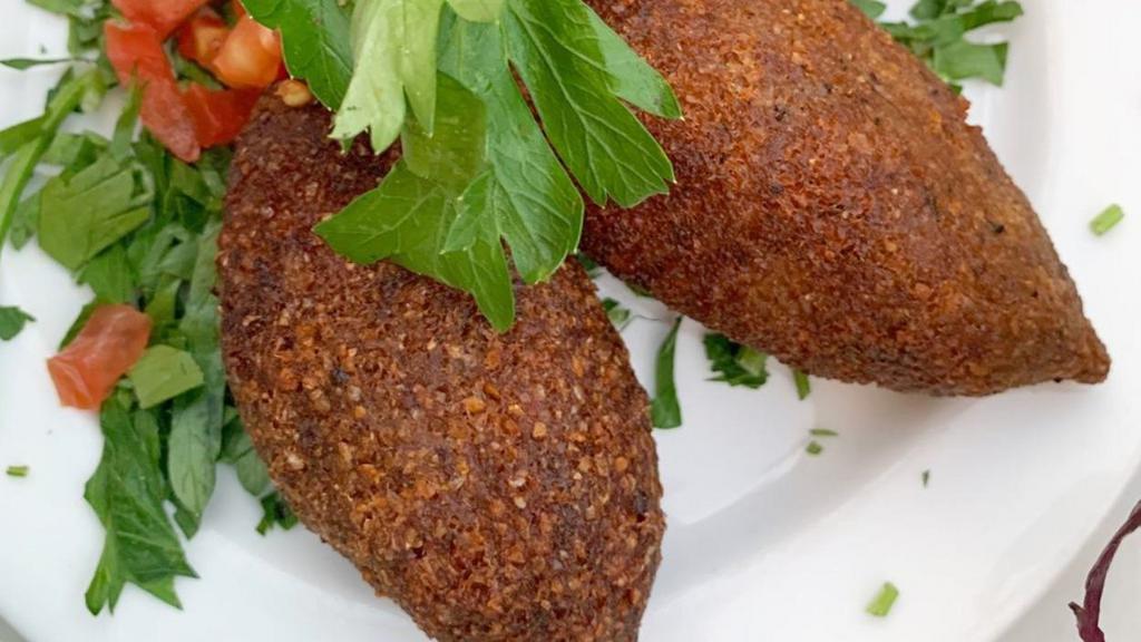  - Kibbeh Kras · Lebanon's national dish. A mixture of lean beef and bulgur wheat filled with a mixture of ground beef, diced onions and pine nuts.