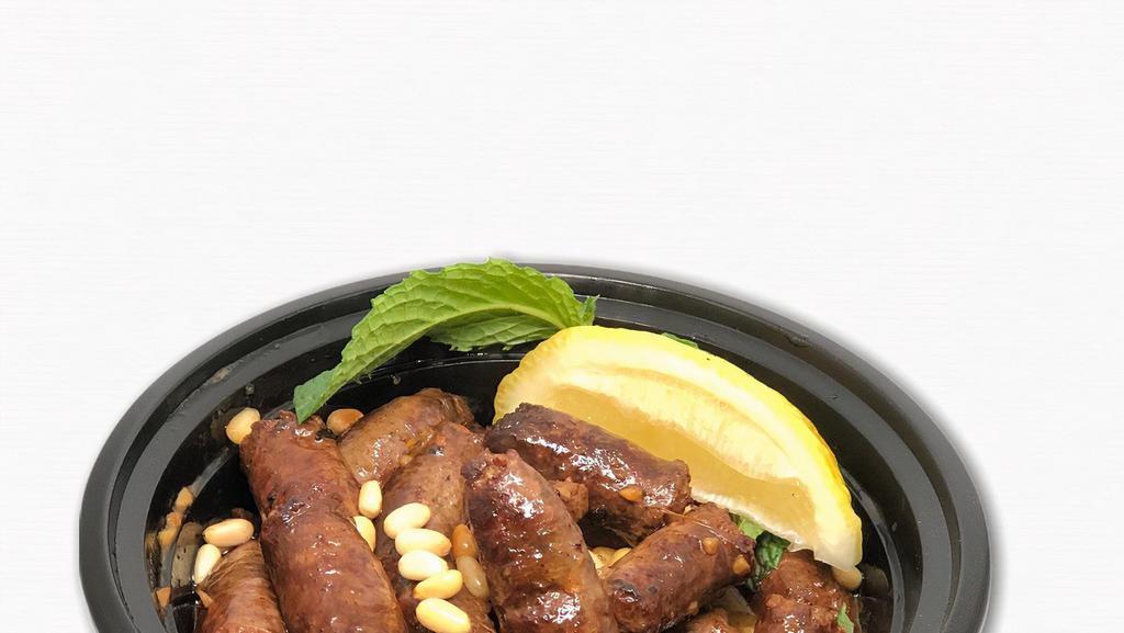  - Makanek · House-made classic Lebanese spiced sausages flambeed with fresh lemon juice.