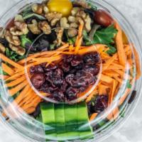 Mesclun Salad · Mixed mesclun greens with walnuts, cranberry raisins, cherry tomatoes, shredded carrots, Eng...