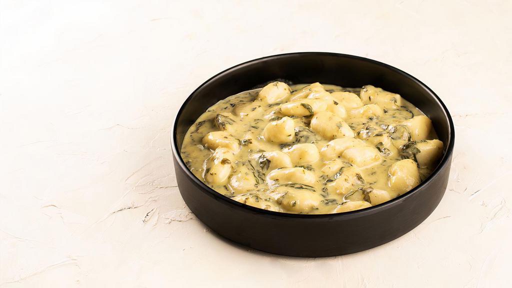 Gnocchi Ai Funghi · Pan seared tender potato dumplings, bianca sauce, with a choice of: Wild Mushrooms, or Creamed Spinach