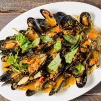 Mussels Pesto Marinara · Fresh mussels in a light pesto and marinara sauce.