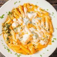 Penne Diana · Penne with chicken, spinach and melted mozzarella cheese ala vodka.