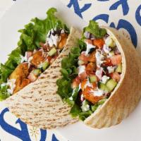 Chicken Gyro Pita · Chicken gyro with lettuce, tomatoes, cucumber, onions, and your choice of sauce wrapped in a...