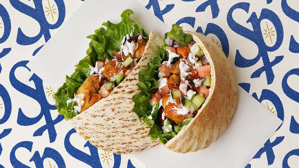 Chicken Gyro Pita · Chicken gyro with lettuce, tomatoes, cucumber, onions, and your choice of sauce wrapped in a pita
