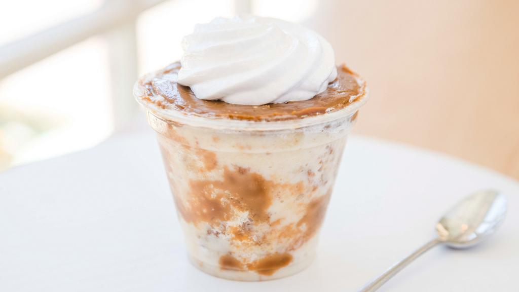 Dulce De Leche Tres Leches · Classic tres leches with a dulce de leche layer and topped with house-made whipped cream.