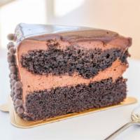 Triple Chocolate Cake · Chocolate lovers heaven! Made with a chocolate sponge cake, layered with a chocolate mousse,...