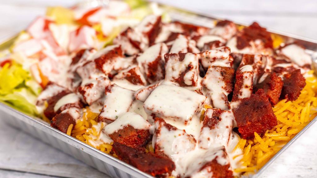 Chicken And Lamb Over Rice, Salad · It comes with white sauce all over.