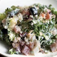 Farida Kale Salad · Mixed fresh kale and romaine hearts, black olives, cranberries, toasted almonds, diced tomat...