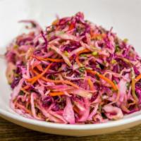 Vitamin Salad · Diced cabbage, carrot, cilantro tossed with olive oil and vinegar.