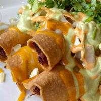 Loaded Taquitos · 4 pcs of golden fried tortillas stuffed with you choice of meat.  Topped with melted shredde...