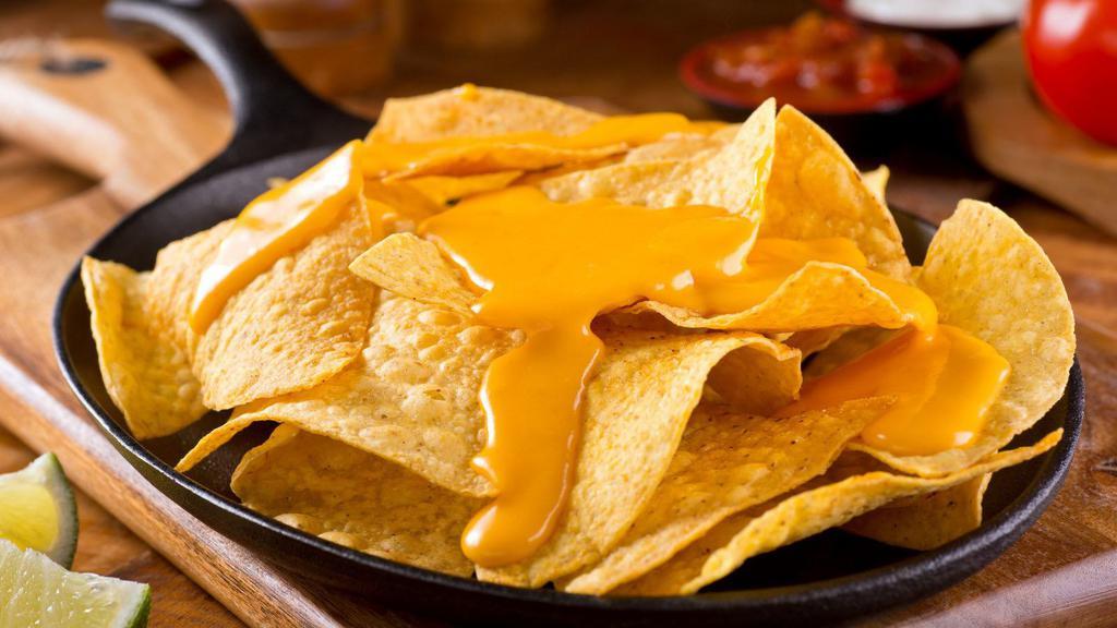 Nachos · Tortilla chips topped with melted cheese and additional savory toppings.