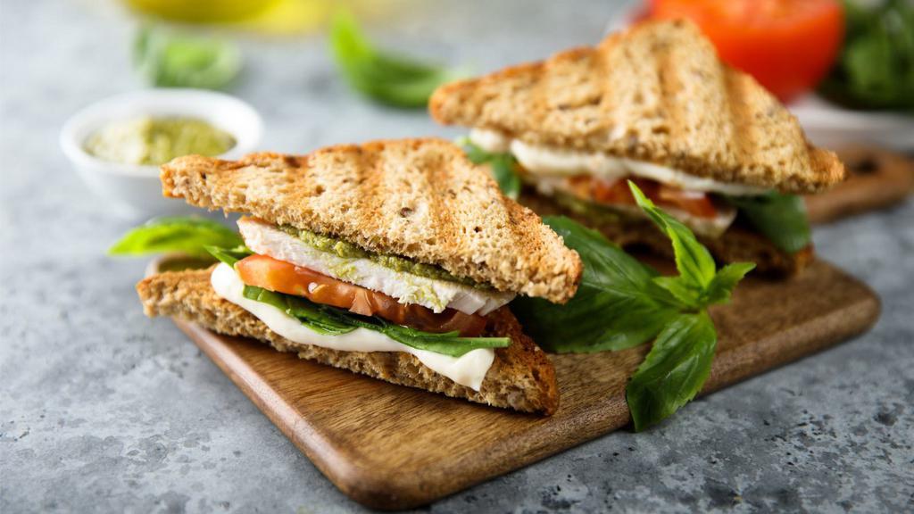 Chicken Spinach Panini · Perfectly grilled sandwich with whisked mayonnaise, spinach and pesto toppings, grilled chicken, seasoned with salt and pepper.