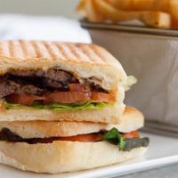 Steak Panini · Perfectly grilled sandwich filled with juicy grilled fajita steak, fontina cheese, and a spi...