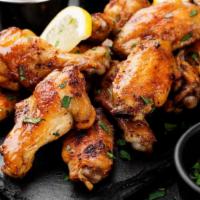 Cajun Chicken Wings · Perfectly cooked chicken wings deep-fried and breaded to a perfect crisp, topped with delici...
