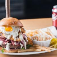 The Hangover · Beef burger, pastrami, onion rings, fried egg, and spicy jalapeño aioli served with lettuce ...