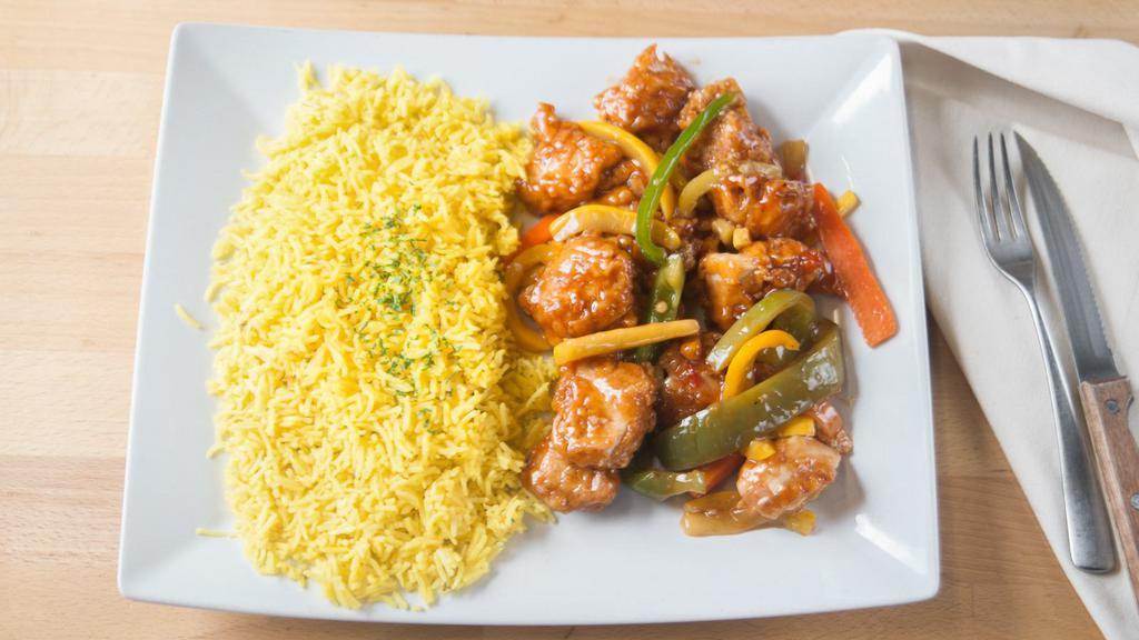 Sweet And Sour Chicken · Battered pieces of chicken and mixed vegetables in our secret sweet and sour sauce served with rice.