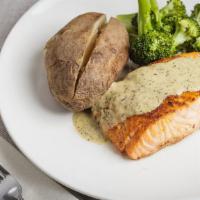 Broiled Fresh Salmon · In lemon butter sauce with mashed potato and garnish.