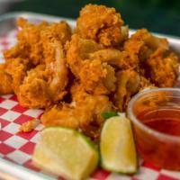 Fried Calamari · Calamari battered with house-made seasoning and deep-fried until golden brown. Served with s...