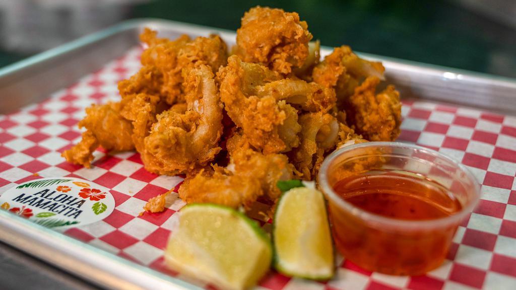 Fried Calamari · Calamari battered with house-made seasoning and deep-fried until golden brown. Served with spicy house garlic sauce.