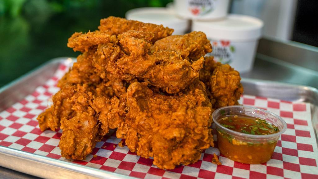 Fried Chicken · Crispy and seasoned chicken thigh. Deep-fried until golden brown. Served with house sauce.