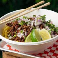 Birra Ramen · Ramen noodles, birria meat, lime, mozzarella, red onions and cilantro with consome.