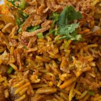 Chicken Biryani · Supreme Long grain Basmati rice stir fried with chunks of bonless chicken thigh onions, spic...
