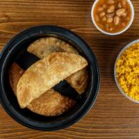 Empanada Combo · Choose any 3 flavors, rice, beans, and sauce.