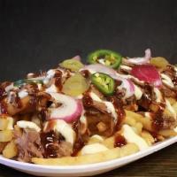 Texas Loaded Fries · Pulled Brisket on crispy fries topped with pickled jalapeno, red onion, Garlic aioli & bbq s...