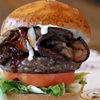 Lower East Side Pastrami Burger · Lettuce, tomato, Grilled Pastrami, Barbeque sauce & Garlic Aioli.
