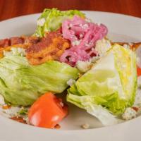 The Wedge · Iceberg lettuce, tomato, bacon, pickled onions with blue cheese. Add steak, chicken or shrim...