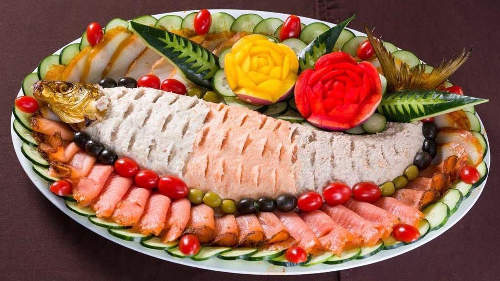 Fish Platter · Includes white fish nicely shaped like a fish slices lax and sabel with vegetables for decoration. Small for 10 people. Medium for 15 people. Large for 20 people.