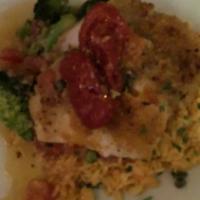 Oreganata Style Halibut · Topped with pureed tomatoes and served with saffron rice broccoli. Drizzled with light lemon...